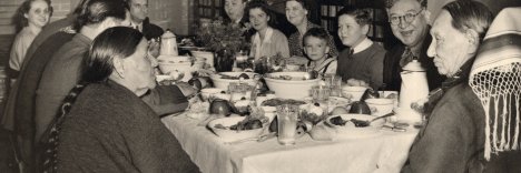 Photo Caption: Chief Fred Lookout at the head of the dinner table with his wife Julia Lookout to his left, n.d. ONM Collection P01-1261.
